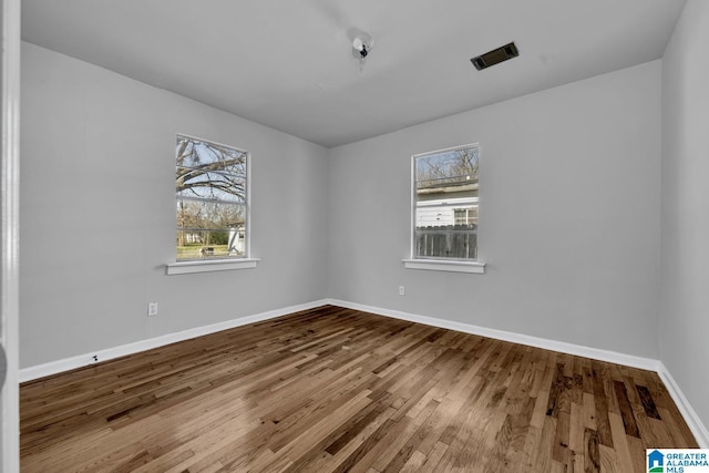 empty room featuring hardwood / wood-style flooring