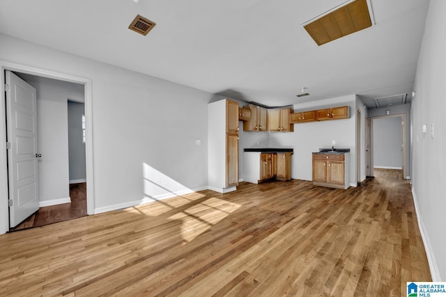 unfurnished living room with light hardwood / wood-style floors