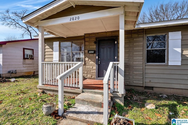 entrance to property featuring cooling unit