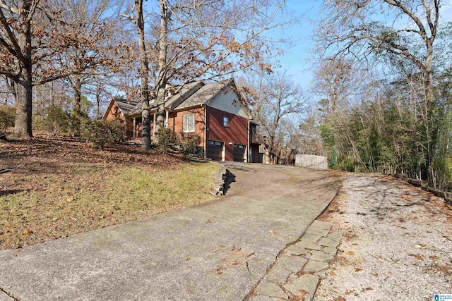 view of property exterior with a garage