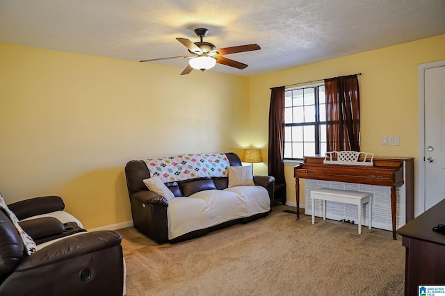 carpeted living room with a textured ceiling and ceiling fan