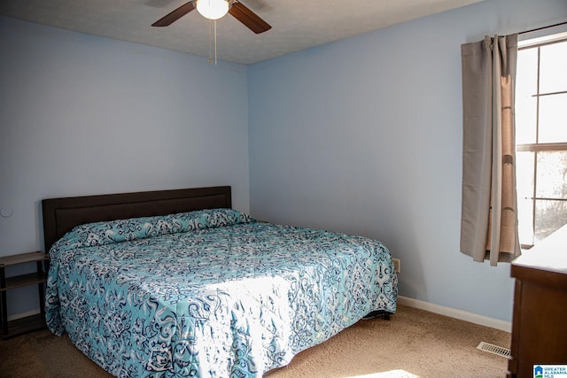 bedroom featuring ceiling fan and carpet flooring