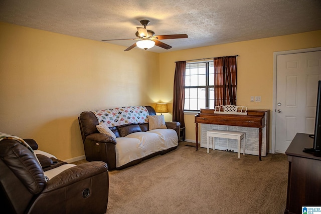 living room with a textured ceiling, ceiling fan, and carpet floors