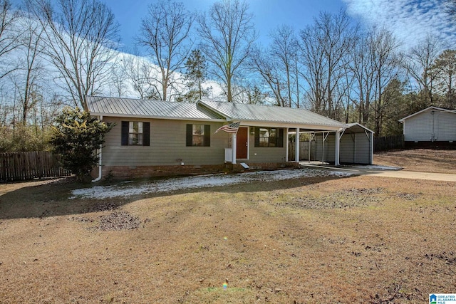 single story home with a front yard and a carport