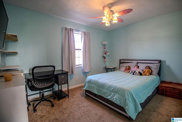 carpeted bedroom with a textured ceiling and ceiling fan