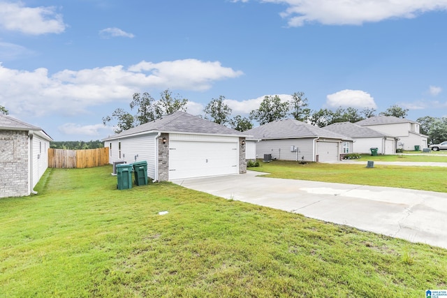 view of front of home featuring a front lawn and a garage