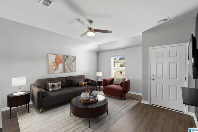 living room with ceiling fan and hardwood / wood-style floors