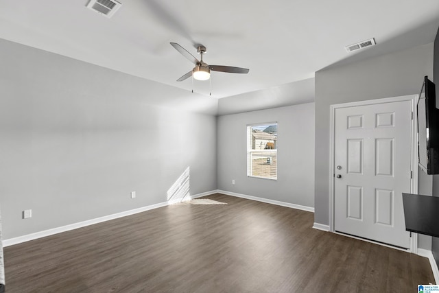 unfurnished room featuring ceiling fan and dark hardwood / wood-style floors