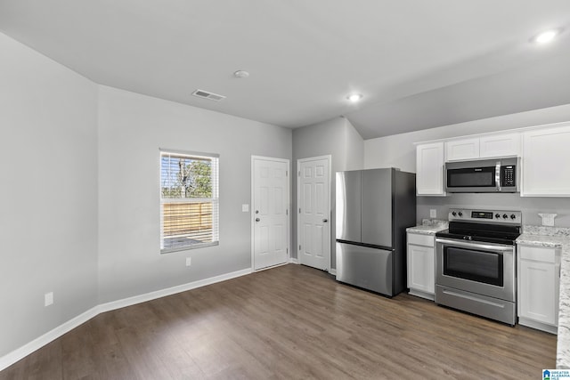 kitchen featuring stainless steel appliances, dark wood-type flooring, and white cabinetry