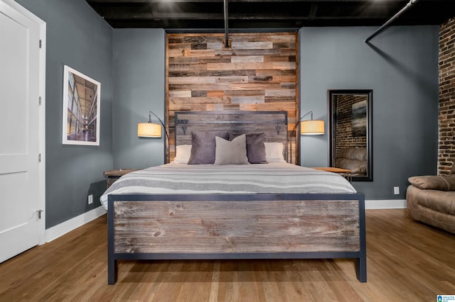 bedroom with wood-type flooring