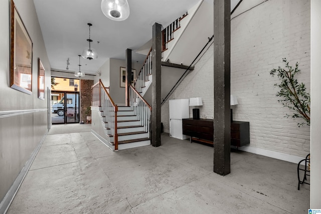 interior space featuring brick wall