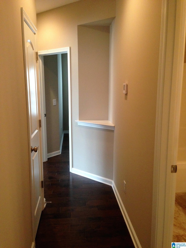 hallway featuring dark hardwood / wood-style flooring