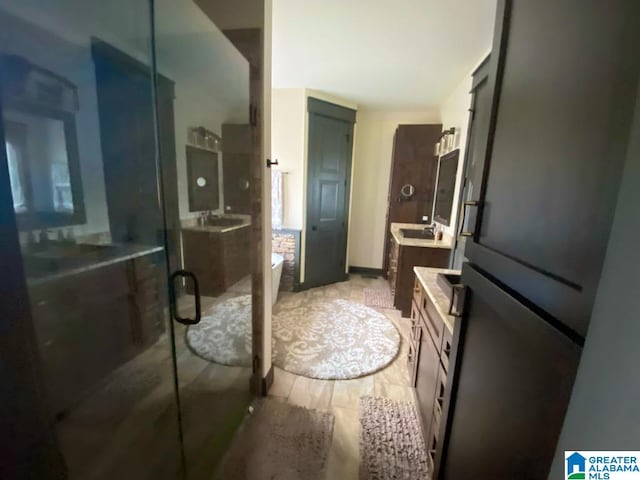 bathroom featuring shower with separate bathtub