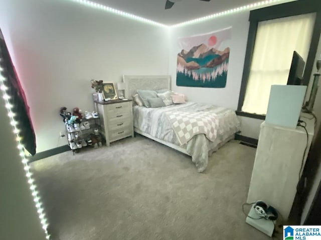 carpeted bedroom with ceiling fan