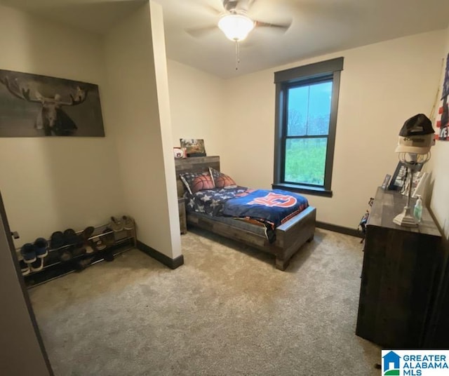 carpeted bedroom with ceiling fan