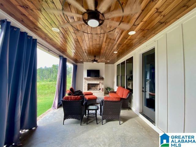 view of patio featuring ceiling fan