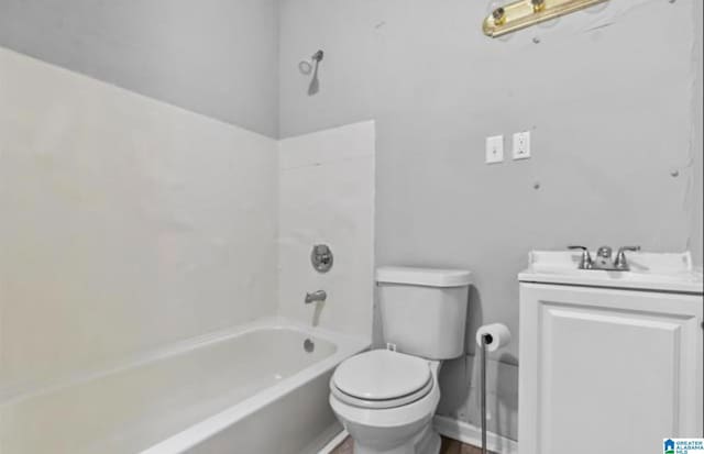 full bathroom featuring toilet, vanity, and bathtub / shower combination