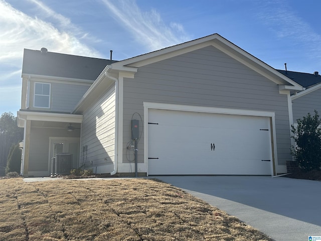 view of property exterior with concrete driveway and an attached garage
