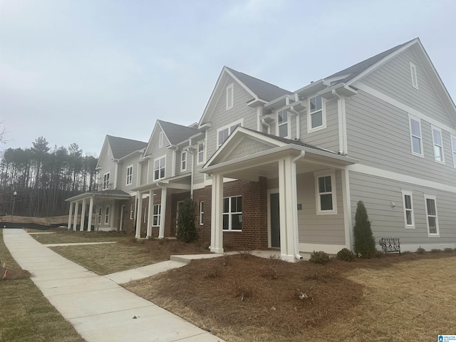 view of property exterior featuring covered porch