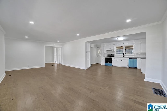 unfurnished living room featuring sink, crown molding, and wood-type flooring