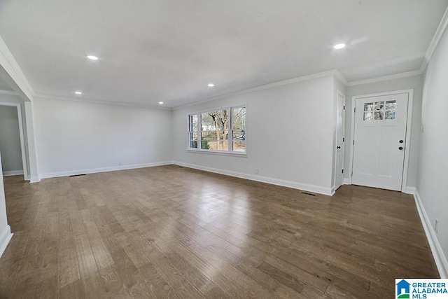 unfurnished living room with dark hardwood / wood-style flooring and crown molding