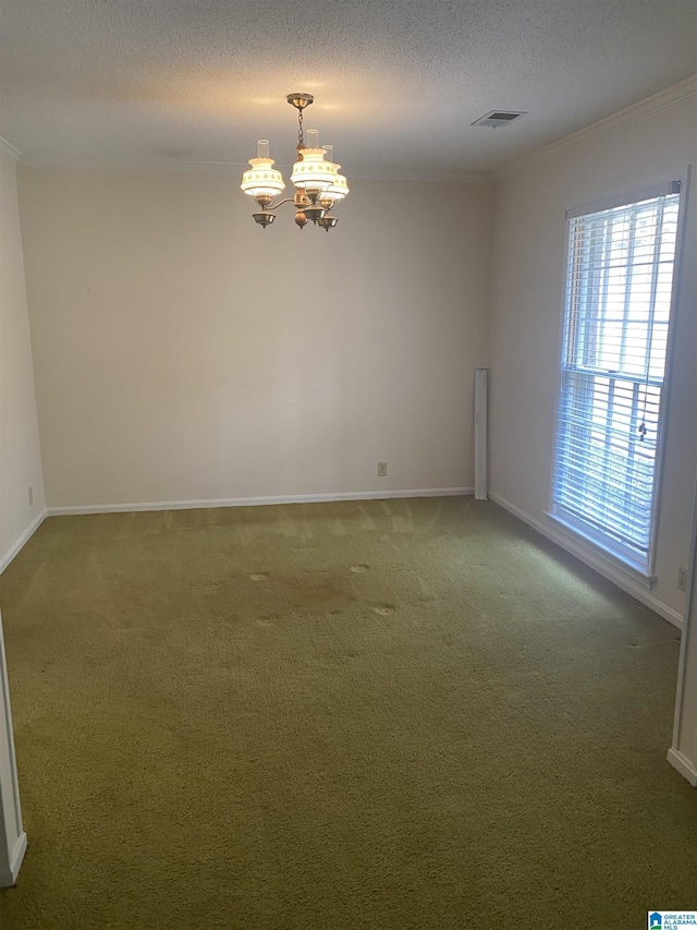 empty room featuring visible vents, light colored carpet, baseboards, an inviting chandelier, and ornamental molding