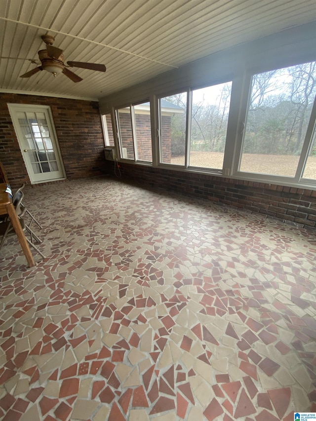 unfurnished sunroom featuring a wealth of natural light