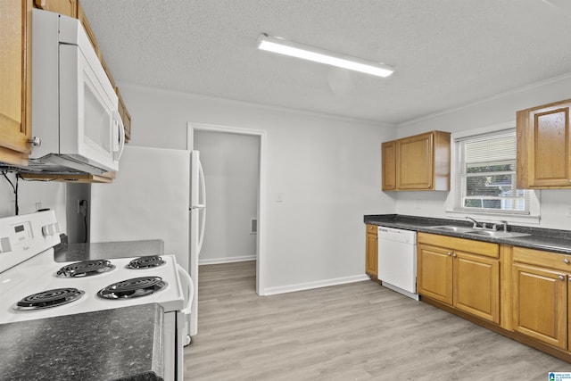 kitchen featuring white appliances, a textured ceiling, light hardwood / wood-style floors, crown molding, and sink