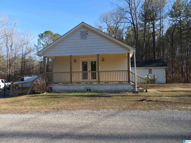 bungalow-style house featuring french doors and covered porch