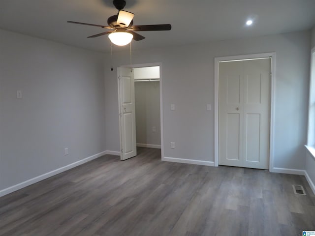 unfurnished bedroom featuring ceiling fan and hardwood / wood-style flooring