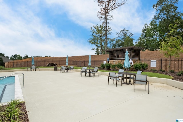 view of pool with a patio area and a pergola