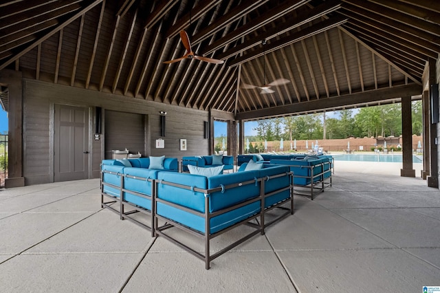 view of property's community featuring a gazebo, a patio area, a pool, and an outdoor living space