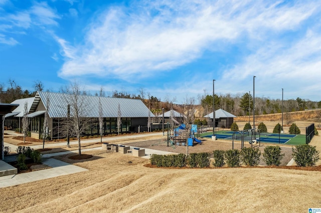 view of playground with tennis court