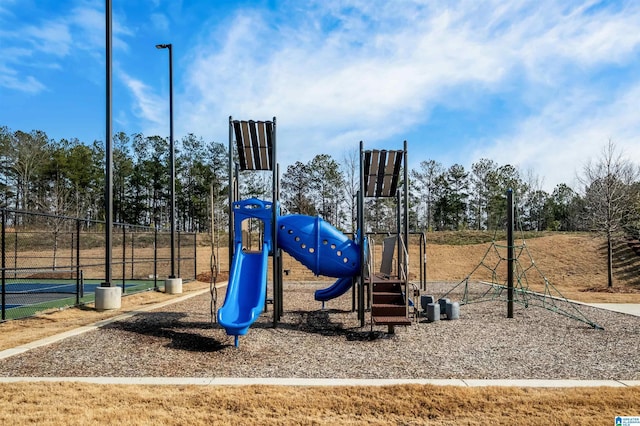 view of playground featuring tennis court