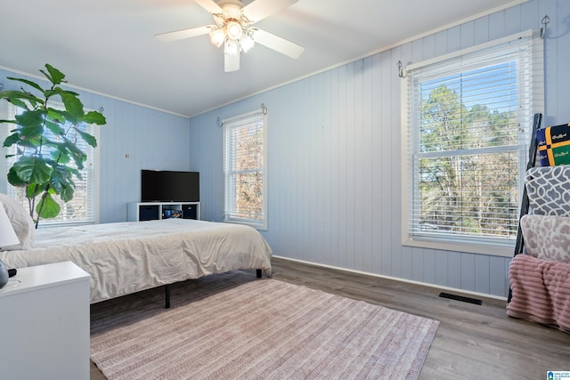 bedroom with ceiling fan and hardwood / wood-style floors