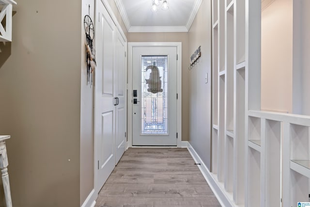 doorway featuring built in shelves, light hardwood / wood-style flooring, and crown molding