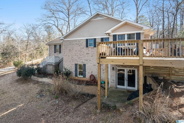 back of property featuring french doors and a deck