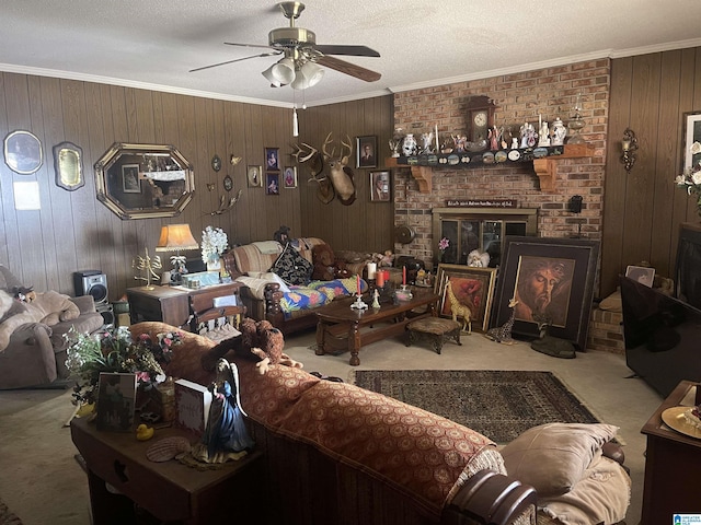 carpeted living room featuring ornamental molding, a textured ceiling, and ceiling fan