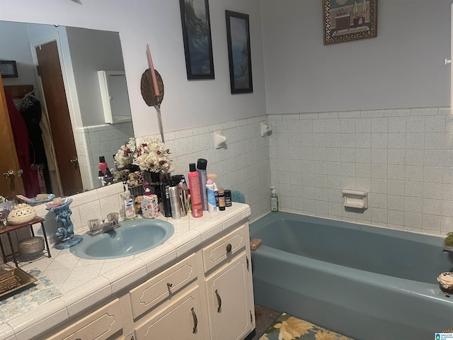 bathroom featuring a bath and vanity