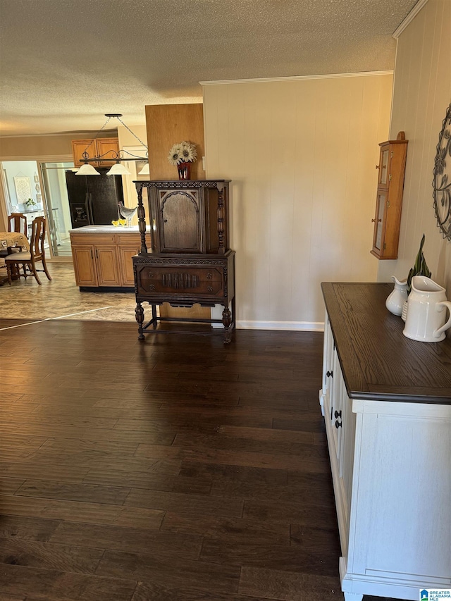 interior space featuring dark hardwood / wood-style flooring and a textured ceiling