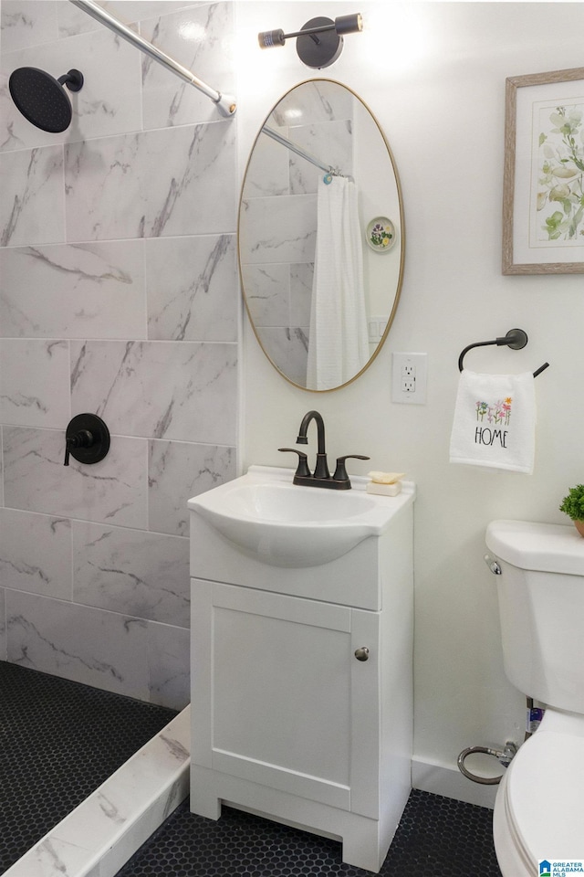 bathroom with tile patterned flooring, toilet, vanity, and a shower with curtain