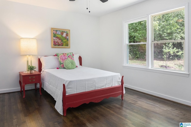 bedroom featuring ceiling fan and dark hardwood / wood-style floors