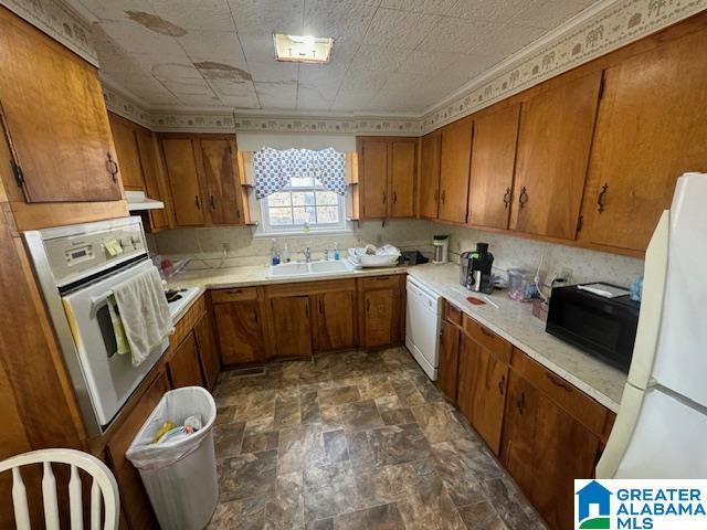 kitchen with sink and white appliances