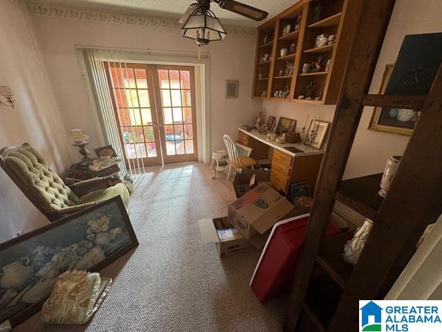 interior space featuring ceiling fan and french doors