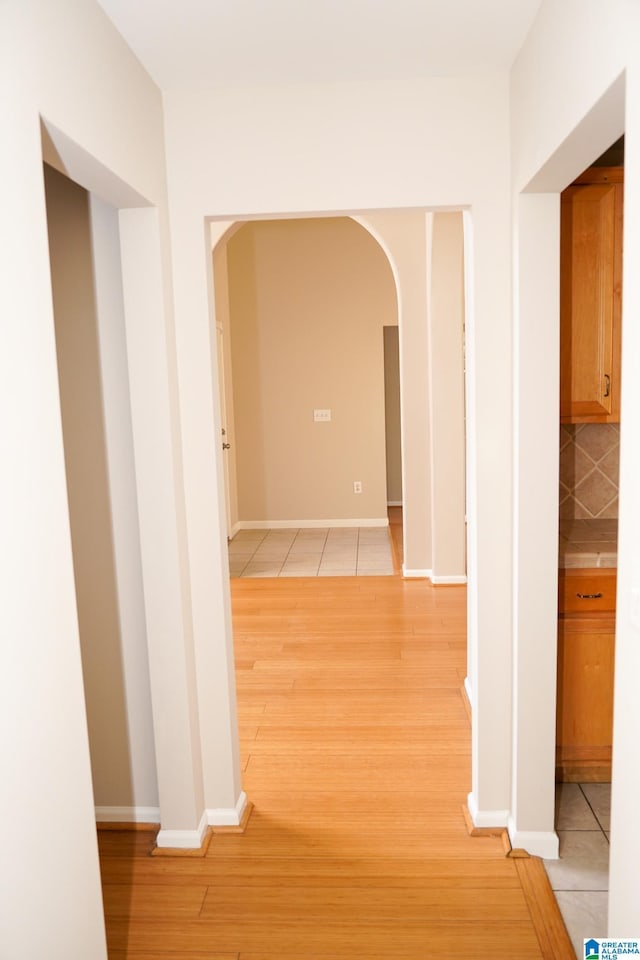 corridor with light tile patterned flooring