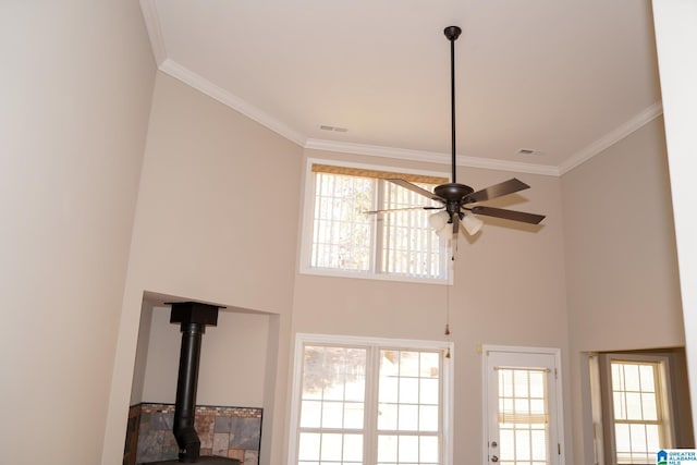 room details with ceiling fan and ornamental molding