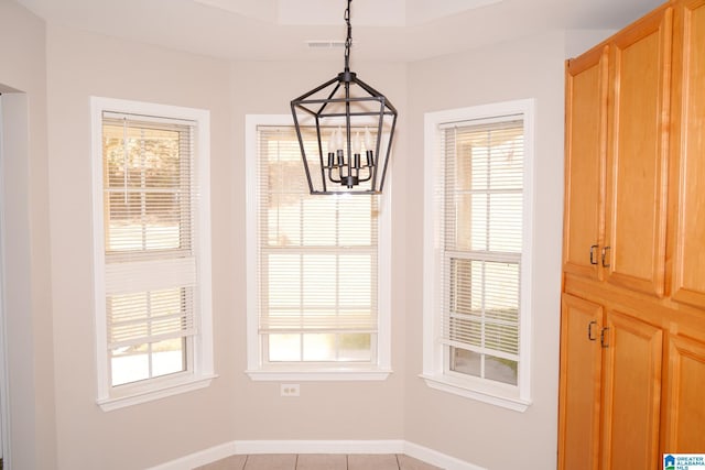 unfurnished dining area with light tile patterned flooring and a chandelier