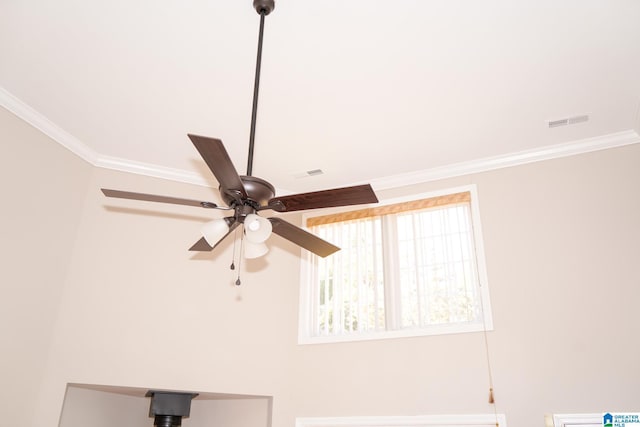 interior details with ceiling fan and ornamental molding