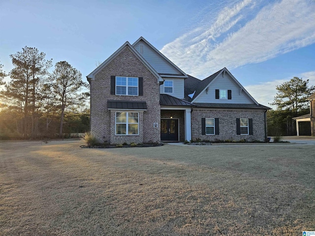 craftsman inspired home with a front lawn