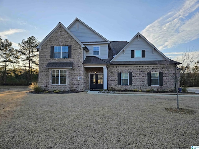 craftsman-style home featuring french doors